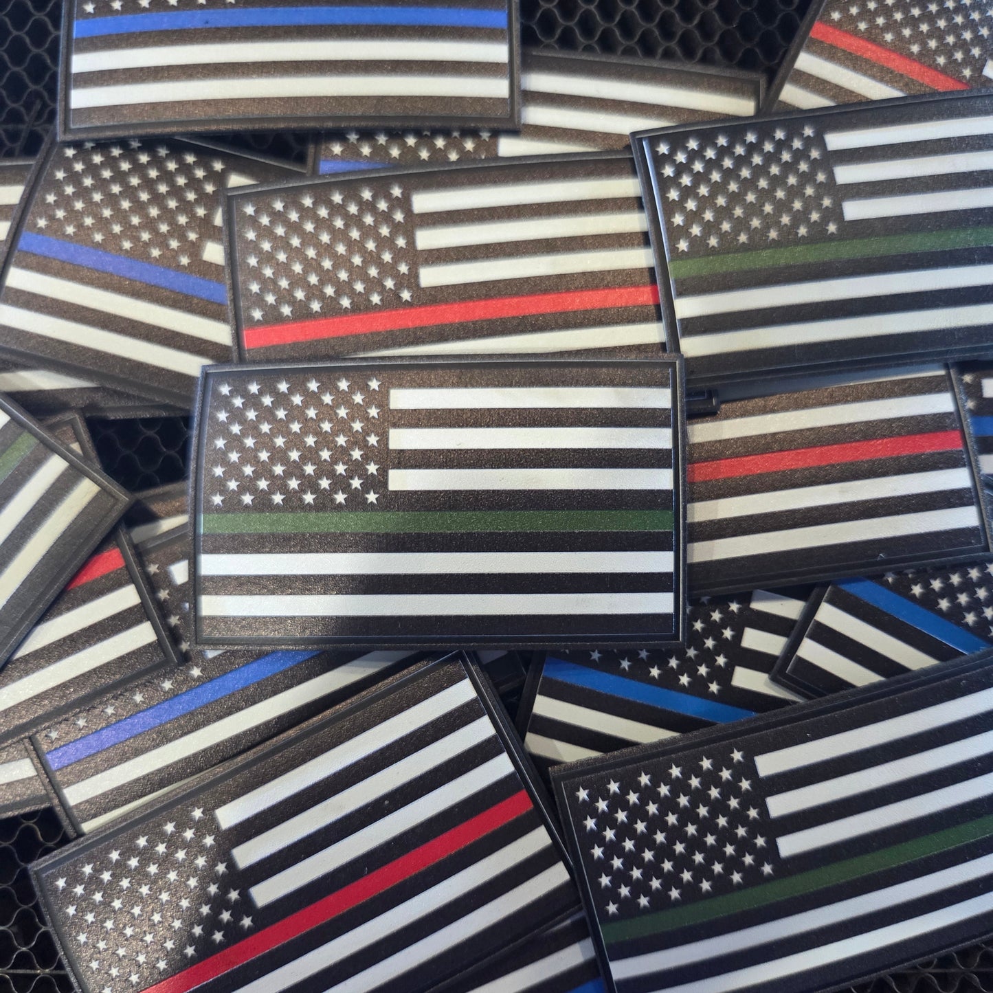 Collection of American flag patches with various color schemes.